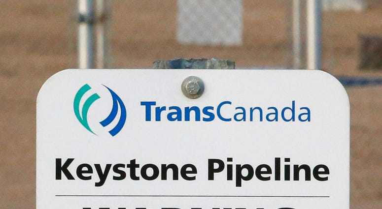 FILE- This Nov. 6, 2015, file photo shows a sign for TransCanada's Keystone pipeline facilities in Hardisty, Alberta, Canada. (Jeff McIntosh/The Canadian Press via AP, File)