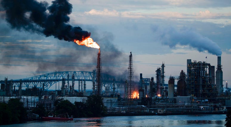 (AP Photo/Matt Rourke) Flames and smoke emerge from the Philadelphia Energy Solutions Refining Complex in Philadelphia, Friday, June 21, 2019. (AP Photo/Matt Rourke)