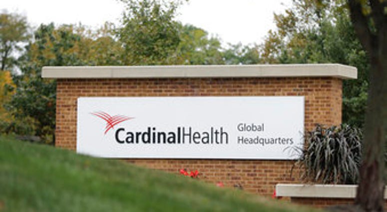A sign is displayed at the Cardinal Health, Inc. corporate office in Dublin, Ohio. Shares of big drug distributors soared Wednesday on word of a potential settlement ahead of the first federal trial over the opioid crisis. (AP Photo/Darron Cummings)