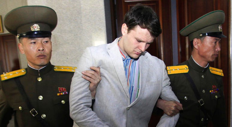 FILE - In this March 16, 2016, file photo, American student Otto Warmbier, center, is escorted at the Supreme Court in Pyongyang, North Korea. North Korea reportedly insisted the U.S. pay $2 million in medical costs in 2017 before it released Warmbier wh