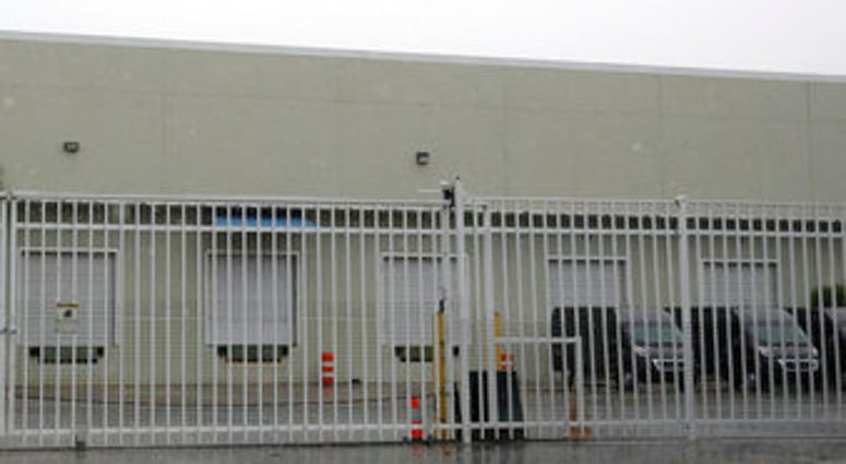 This Thursday, April 30, 2020 photo shows the gate outside a warehouse in Weston, Fla. used by the U.S. Drug Enforcement Agency. (AP Photo/Wilfredo Lee) This Thursday, April 30, 2020 photo shows the gate outside a warehouse in Weston, Fla. used by the U.S. Drug Enforcement Agency. (AP Photo/Wilfredo Lee)