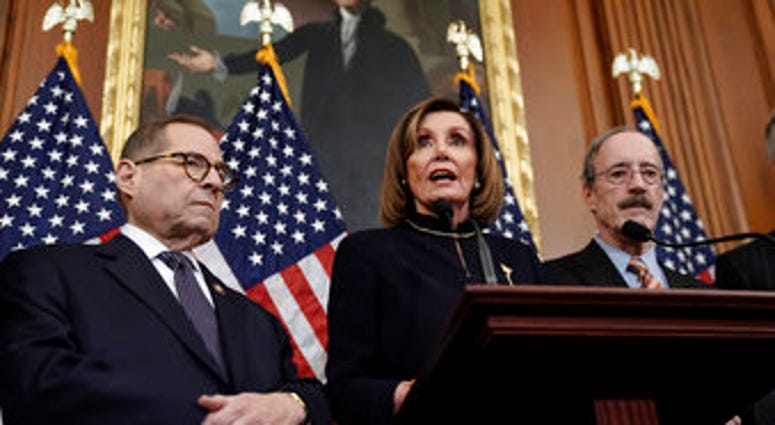 Speaker of the House Nancy Pelosi, D-Calif., flanked by House Judiciary Committee Chairman Jerrold Nadler, D-N.Y., left, and House Foreign Affairs Committee Chairman Eliot Engel, D-N.Y., speaks reporters at the Capitol. (AP Photo/J. Scott Applewhite) Speaker of the House Nancy Pelosi, D-Calif., flanked by House Judiciary Committee Chairman Jerrold Nadler, D-N.Y., left, and House Foreign Affairs Committee Chairman Eliot Engel, D-N.Y., speaks reporters at the Capitol. (AP Photo/J. Scott Applewhite)