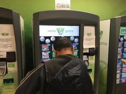A man purchases a Virginia Lottery ticket ahead of the record $1.6 billion drawing for MegaMillions on October 23, 2018. (Matt Demlein, WRVA)