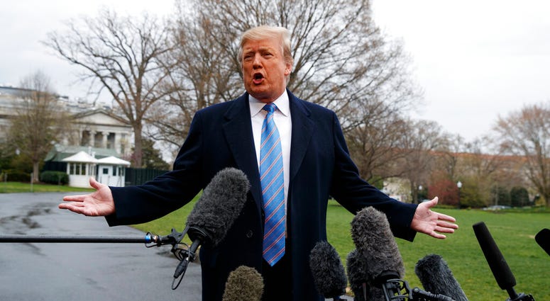 President Donald Trump speaks with reporters before boarding Marine One on the South Lawn of the White House, Friday, April 5, 2019, in Washington. (AP Photo/Evan Vucci)