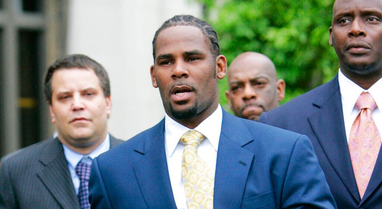 FILE - In this June 13, 2008 file photo, R&B singer R. Kelly leaves the Cook County Criminal Court Building in Chicago. (AP Photo/Nam Y. Huh, File)