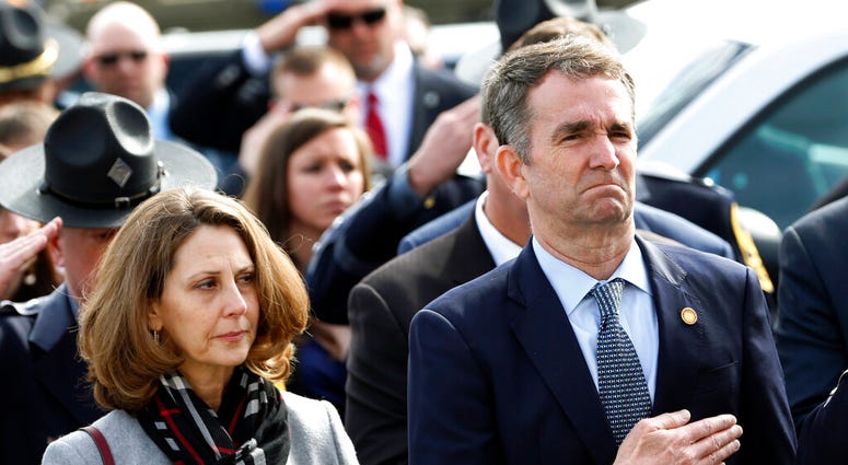 FILE - Feb. 9, 2019 file photo of Virginia Gov. Ralph Northam, right, and his wife Pam. (AP Photo/Steve Helber, Pool, File)