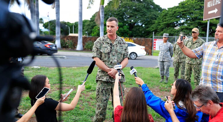 U.S. Navy Rear Adm. Robb Chadwick speaks to the media at the main gate at Joint Base Pearl Harbor-Hickam, Wednesday, Dec. 4, 2019, in Hawaii, following a shooting. (AP Photo/Marco Garcia) U.S. Navy Rear Adm. Robb Chadwick speaks to the media at the main gate at Joint Base Pearl Harbor-Hickam, Wednesday, Dec. 4, 2019, in Hawaii, following a shooting. (AP Photo/Marco Garcia)