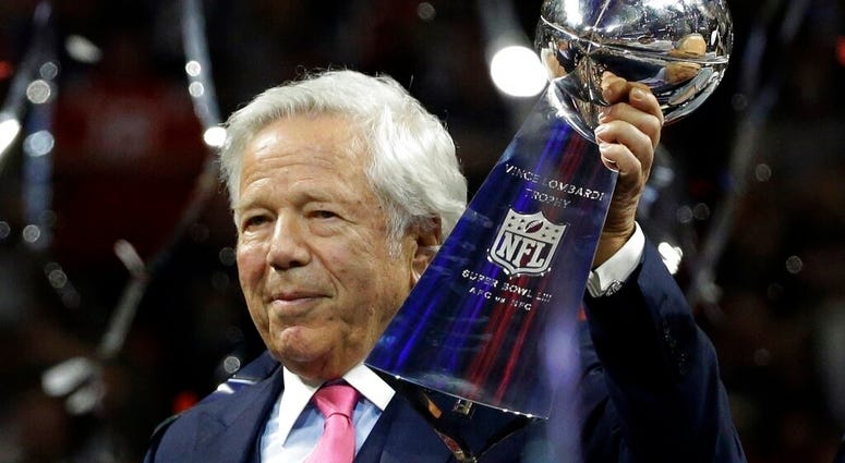 FILE - In this Feb. 3, 2019, file photo, New England Patriots owner Robert Kraft holds the Vince Lombardi trophy after the NFL Super Bowl 53 football game. (AP Photo/Mark Humphrey, File)