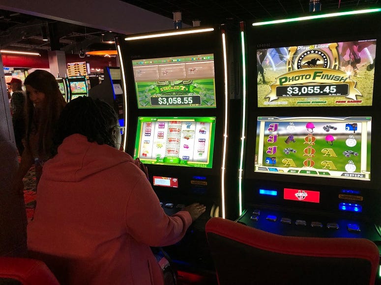 A woman plays "slots" at Rosie's Gaming Emporium in New Kent on April 23, 2019. (Matt Demlein, WRVA)