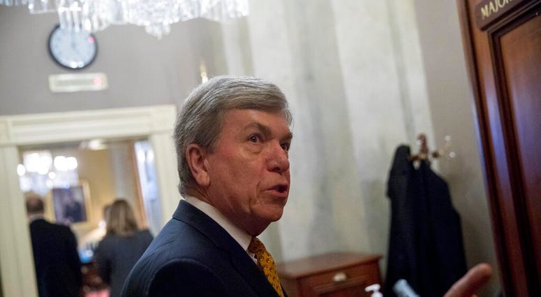 Rep. Roy Blunt, R-Mo., speaks to reporters as he walks into a meeting with Republican Senate leadership at the offices of Senate Majority Leader Mitch McConnell of Ky. on Capitol Hill, Monday, Feb. 11, 2019, in Washington. (AP Photo/Andrew Harnik)