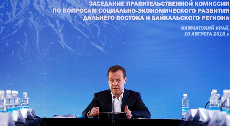 Russian Prime Minister Dmitry Medvedev on Friday, Aug. 10, 2018, sternly warned the U.S. against ramping up sanctions, saying that Moscow will retaliate. (Dmitry Astakhov, Sputnik, Government Pool Photo via AP)