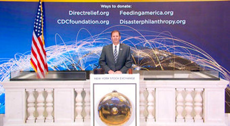 In this photo taken from video provided by the New York Stock Exchange, NYSE Security Director Gregory Crane rings the opening bell at the NYSE on Wednesday, April 1, 2020. (New York Stock Exchange via AP) In this photo taken from video provided by the New York Stock Exchange, NYSE Security Director Gregory Crane rings the opening bell at the NYSE on Wednesday, April 1, 2020. (New York Stock Exchange via AP)