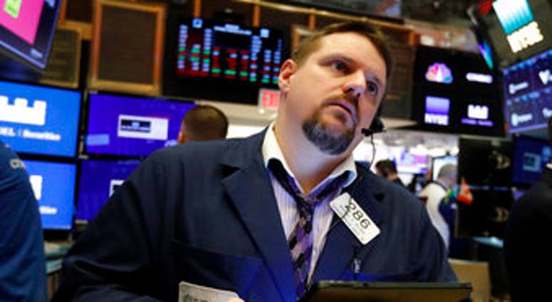 FILE - In this Feb. 24, 2020, file photo trader Michael Milano works on the floor of the New York Stock Exchange. The U.S. stock market opens at 9:30 a.m. EST on Thursday, Feb. 27. (AP Photo/Richard Drew, File) FILE - In this Feb. 24, 2020, file photo trader Michael Milano works on the floor of the New York Stock Exchange. The U.S. stock market opens at 9:30 a.m. EST on Thursday, Feb. 27. (AP Photo/Richard Drew, File)
