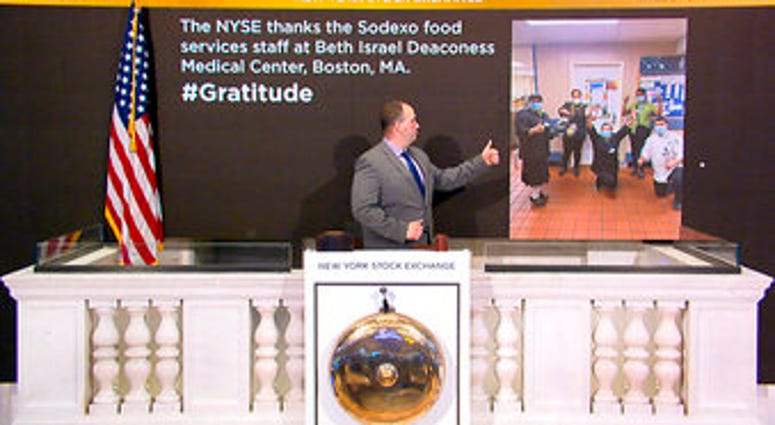In this image taken from video provided by the New York Stock Exchange, Tommy Gannon, Assistant Supervisor, Facilities, rings the opening bell at the NYSE. (New York Stock Exchange via AP) In this image taken from video provided by the New York Stock Exchange, Tommy Gannon, Assistant Supervisor, Facilities, rings the opening bell at the NYSE. (New York Stock Exchange via AP)