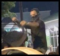 The male in the black shirt is suspected of arson and vandalism over several hours on July 25, 2020 The male in the black shirt is suspected of arson and vandalism over several hours on July 25, 2020