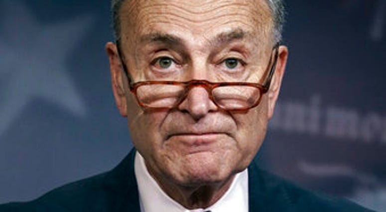 FILE - In this Monday, Dec. 9, 2019, file photo, Senate Minority Leader Chuck Schumer, D-N.Y., speaks to reporters on Capitol Hill in Washington. (AP Photo/J. Scott Applewhite, File) FILE - In this Monday, Dec. 9, 2019, file photo, Senate Minority Leader Chuck Schumer, D-N.Y., speaks to reporters on Capitol Hill in Washington. (AP Photo/J. Scott Applewhite, File)