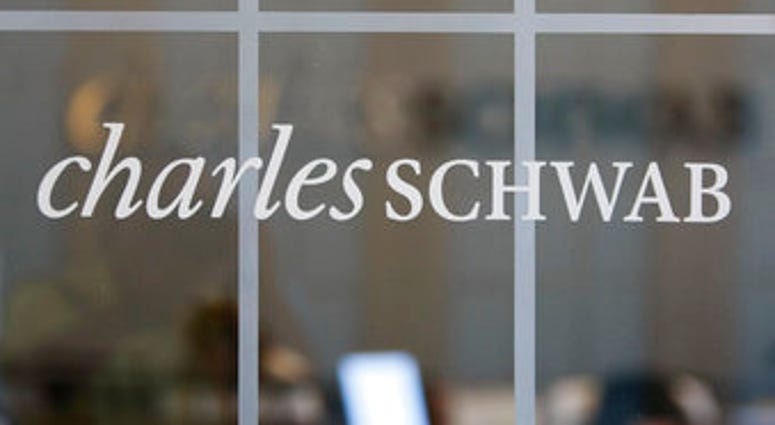 FILE - This July 14, 2010, file photo, shows a Charles Schwab office in Oakland, Calif. Charles Schwab is buying TD Ameritrade for $26 billion, a blockbuster deal accelerated by disruption in the online brokerage industry. (AP Photo/Paul Sakuma, File) FILE - This July 14, 2010, file photo, shows a Charles Schwab office in Oakland, Calif. Charles Schwab is buying TD Ameritrade for $26 billion, a blockbuster deal accelerated by disruption in the online brokerage industry. (AP Photo/Paul Sakuma, File)