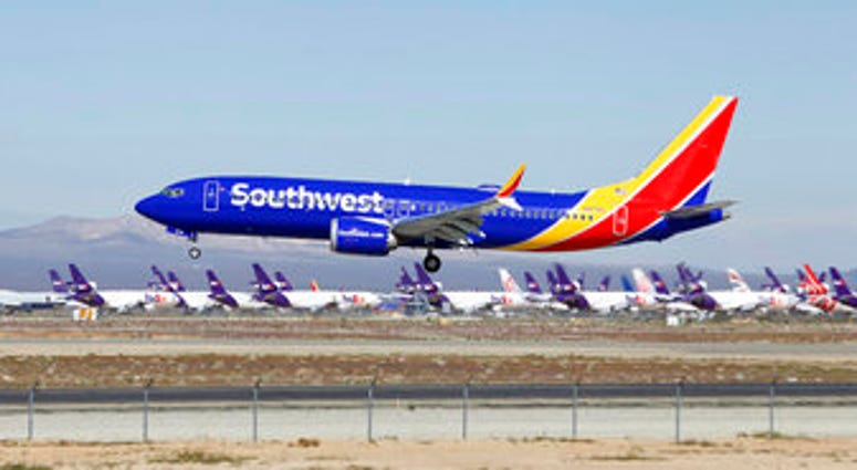 FILE - In this March 23, 2019, file photo, a Southwest Airlines Boeing 737 Max aircraft lands at the Southern California Logistics Airport in the high desert town of Victorville, Calif. (AP Photo/Matt Hartman, File)