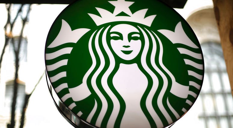 FILE - This March 24, 2018, file photo shows a sign in a Starbucks in downtown Pittsburgh. Starbucks is getting rid of plastic straws at its locations around the world. The coffee company said Monday, July 9, 2018, that it’ll offer a strawless lid or stra