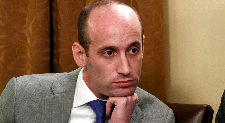 FILE - In this June 21, 2018, file photo, White House senior adviser Stephen Miller listens as President Donald Trump speaks during a cabinet meeting at the White House in Washington. The White House has declined to make Miller available for testimony bef