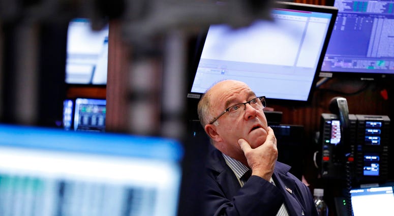 Trader Frederick Reimer works on the floor of the New York Stock Exchange, Wednesday, Jan. 2, 2019. Stock markets started the new year with a tumble, as disappointing Chinese economic data on Wednesday renewed concerns. (AP Photo/Richard Drew)