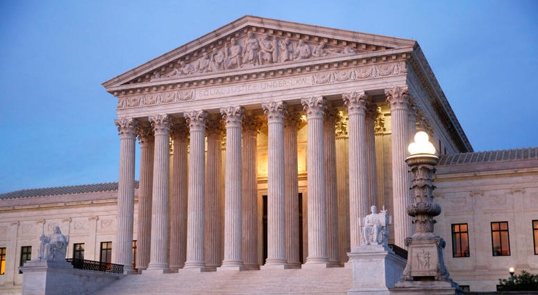 In this May 23, 2019 photo, the U.S. Supreme Court building at dusk on Capitol Hill in Washington. (AP Photo/Patrick Semansky)
