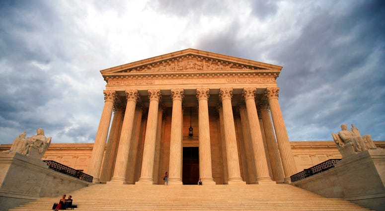 The U.S. Supreme Court is seen at near sunset in Washington, Thursday, Oct. 4, 2018. (AP Photo/Manuel Balce Ceneta)