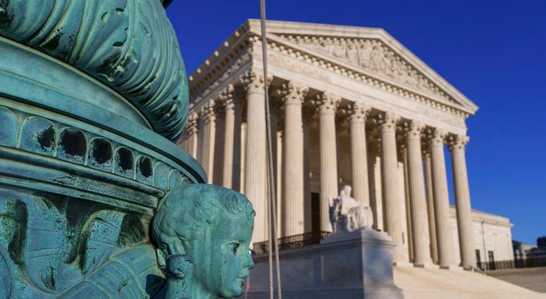 The Supreme Court is seen in Washington, April 20, 2018. The Supreme Court says employers can prohibit their workers from banding together to complain about pay and conditions in the workplace. (AP Photo/J. Scott Applewhite)