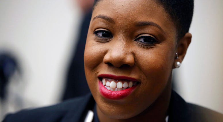 FILE - In this Jan. 11, 2016 file photo, Symone Sanders speaks to members of the media. Joe Biden has hired the prominent African American political strategist as a senior adviser to his newly launched presidential campaign. (AP Photo/Andrew Harnik)