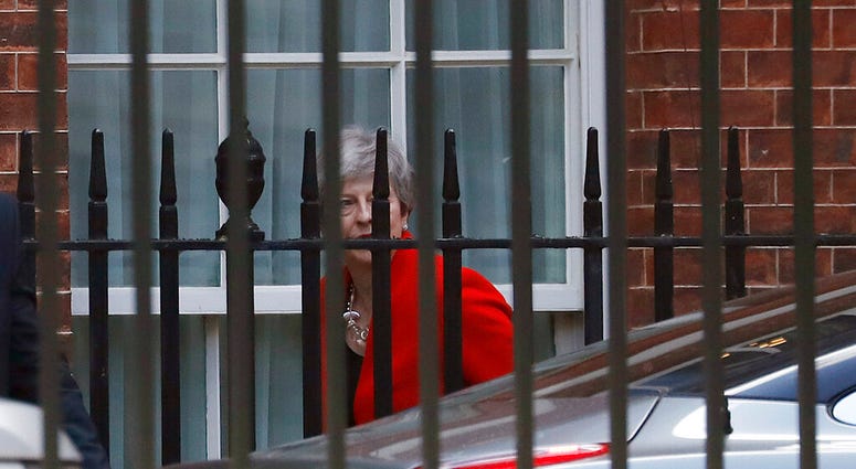 Britain's Prime Minister Theresa May leaves Downing Street in London, Friday, May 24, 2019. May announced Friday that she will step down as U.K. Conservative Party leader on June 7. (AP Photo/Frank Augstein)