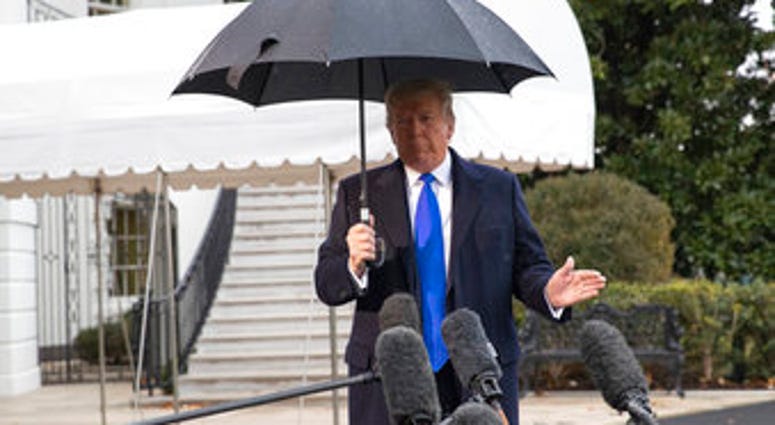President Donald Trump speaks with reporters on the South Lawn of the White House before departing, Monday, Dec. 2, 2019, in Washington. (AP Photo/Alex Brandon) President Donald Trump speaks with reporters on the South Lawn of the White House before departing, Monday, Dec. 2, 2019, in Washington. (AP Photo/Alex Brandon)
