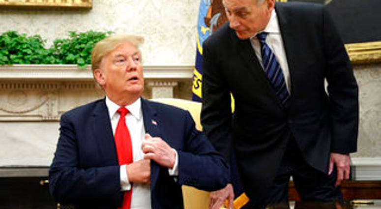 FILE - In this June 27, 2018 file photo, White House Chief of Staff John Kelly, right, leans in to talk with President Donald Trump during Trump's meeting with Portuguese President Marcelo Rebelo de Sousa. (AP Photo/Pablo Martinez Monsivais) FILE - In this June 27, 2018 file photo, White House Chief of Staff John Kelly, right, leans in to talk with President Donald Trump during Trump's meeting with Portuguese President Marcelo Rebelo de Sousa. (AP Photo/Pablo Martinez Monsivais)