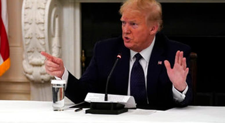 President Donald Trump tells reporters that he is taking zinc and hydroxychloroquine during a meeting with restaurant industry executives about the coronavirus response. (AP Photo/Evan Vucci) President Donald Trump tells reporters that he is taking zinc and hydroxychloroquine during a meeting with restaurant industry executives about the coronavirus response. (AP Photo/Evan Vucci)