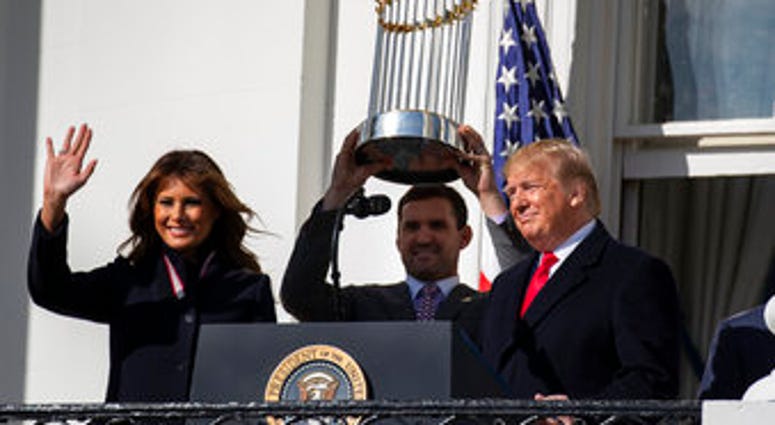 First lady Melania Trump, Washington Nationals infielder Ryan Zimmerman, and President Donald Trump arrive for an event to honor the 2019 World Series Champion Washington Nationals, on the South Lawn of the White House, Monday. (AP Photo/ Evan Vucci)