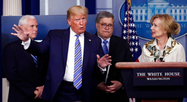 President Trump gestures as he asks a question to Dr. Deborah Birx, White House coronavirus response coordinator, during a briefing about the coronavirus in the James Brady Briefing Room, Monday, March 23, 2020, in Washington. (AP Photo/Alex Brandon) President Trump gestures as he asks a question to Dr. Deborah Birx, White House coronavirus response coordinator, during a briefing about the coronavirus in the James Brady Briefing Room, Monday, March 23, 2020, in Washington. (AP Photo/Alex Brandon)