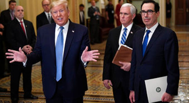 President Donald Trump, left, standing with Vice President Mike Pence and Treasury Secretary Steven Mnuchin, right, talks to reporters about the coronavirus outbreak on Tuesday, March 10, 2020, on Capitol Hill in Washington. (AP Photo/Susan Walsh) President Donald Trump, left, standing with Vice President Mike Pence and Treasury Secretary Steven Mnuchin, right, talks to reporters about the coronavirus outbreak on Tuesday, March 10, 2020, on Capitol Hill in Washington. (AP Photo/Susan Walsh)