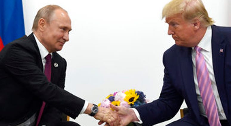 FILE - In this June 28, 2019, file photo, President Donald Trump, right, shakes hands with Russian President Vladimir Putin, left, during a bilateral meeting on the sidelines of the G-20 summit in Osaka, Japan. (AP Photo/Susan Walsh, File) FILE - In this June 28, 2019, file photo, President Donald Trump, right, shakes hands with Russian President Vladimir Putin, left, during a bilateral meeting on the sidelines of the G-20 summit in Osaka, Japan. (AP Photo/Susan Walsh, File)