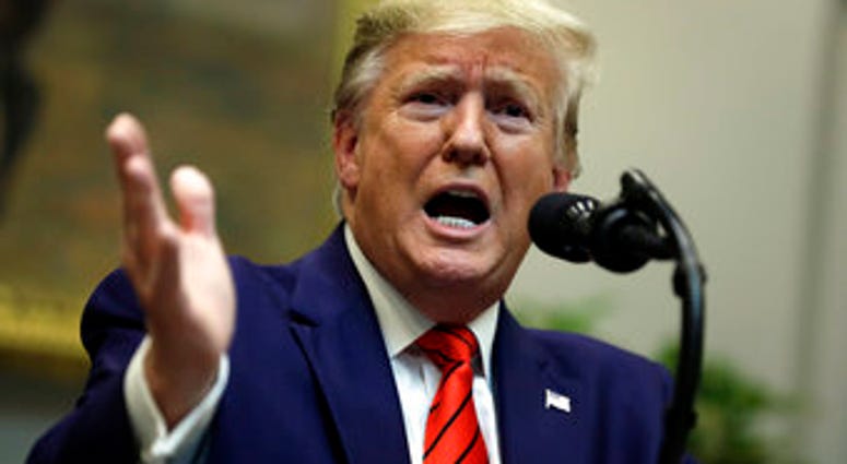 President Donald Trump answers questions from reporters during an event on "transparency in Federal guidance and enforcement" in the Roosevelt Room of the White House, Wednesday, Oct. 9, 2019, in Washington. (AP Photo/Evan Vucci)