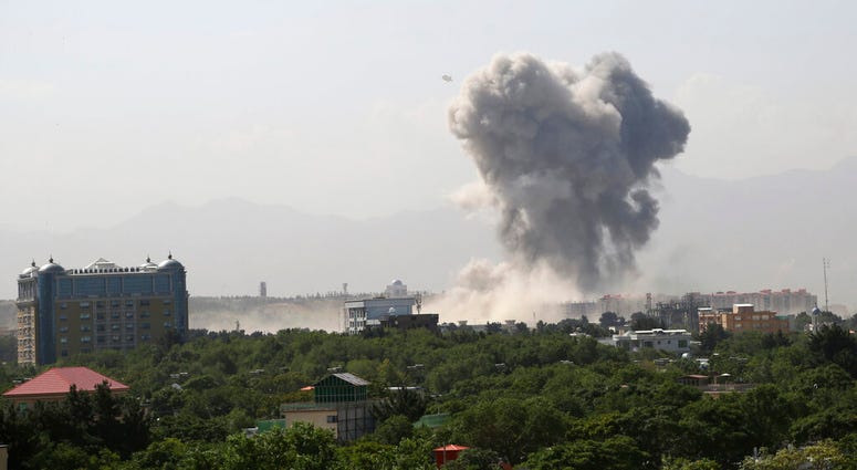 Smokes rises after a huge explosion in Kabul, Afghanistan, Monday, July 1, 2019. Powerful explosion rocks Afghan capital, with smoke seen billowing from downtown area near U.S. Embassy. (AP Photo/Rahmat Gul)