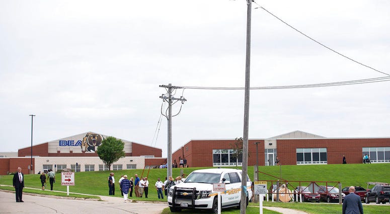People arrive to attend Mollie Tibbetts' funeral at Brooklyn-Guernsey-Malcom High School, Sunday, Aug. 26, 2018, in Brooklyn, Iowa. Cristhian Bahena Rivera is charged with first-degree murder in Tibbetts' death. Authorities have said Tibbetts was abducted