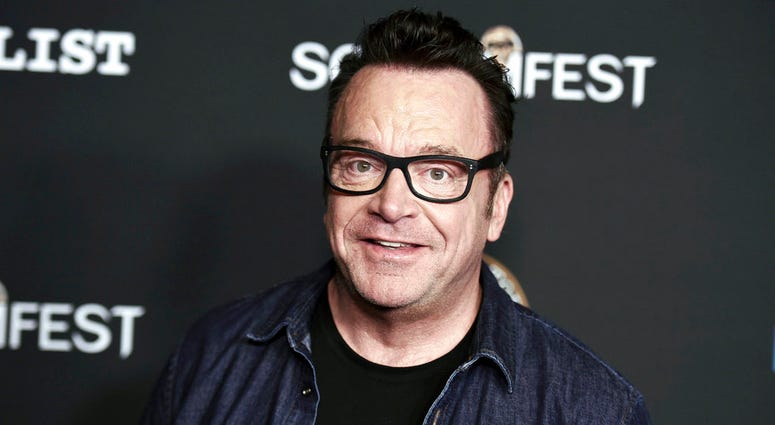 FILE - In this Oct. 10, 2017 file photo, Tom Arnold attends the premiere of "Dead Ant" in Los Angeles. Michael Cohen, President Donald Trump's former attorney, retweeted a photo posing with Arnold, who is working on a show to hunt down recordings of the p