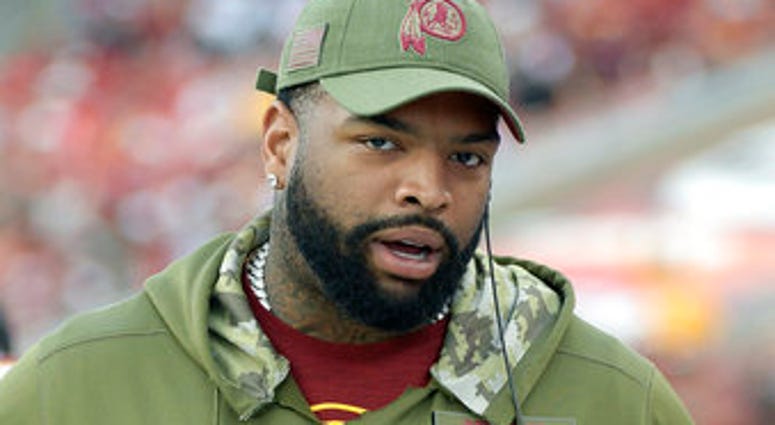 FILE - In this Nov. 11, 2018, file photo, Washington Redskins offensive tackle Trent Williams stands on the sideline during the second half of an NFL football game against the Tampa Bay Buccaneers in Tampa, Fla. (AP Photo/Phelan M. Ebenhack, File)