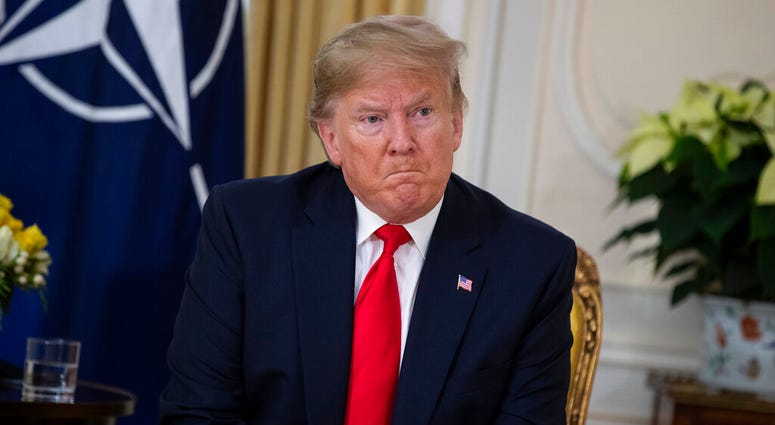 U.S. President Donald Trump speaks during a meeting with NATO Secretary General, Jens Stoltenberg at Winfield House in London, Tuesday, Dec. 3, 2019. (AP Photo/Evan Vucci) U.S. President Donald Trump speaks during a meeting with NATO Secretary General, Jens Stoltenberg at Winfield House in London, Tuesday, Dec. 3, 2019. (AP Photo/Evan Vucci)