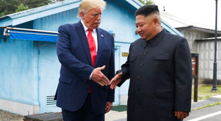 FILE - In this June 30, 2019, file photo, U.S. President Donald Trump meets with North Korean leader Kim Jong Un at the border village of Panmunjom in the Demilitarized Zone, South Korea. (AP Photo/Susan Walsh, File) FILE - In this June 30, 2019, file photo, U.S. President Donald Trump meets with North Korean leader Kim Jong Un at the border village of Panmunjom in the Demilitarized Zone, South Korea. (AP Photo/Susan Walsh, File)