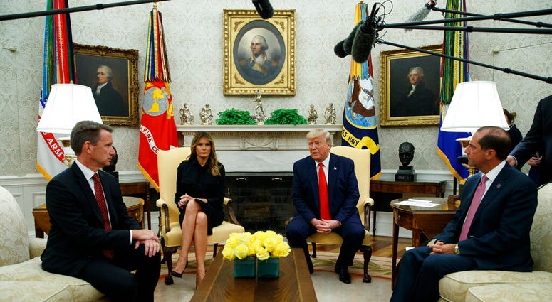 President Donald Trump talks about a plan to ban most flavored e-cigarettes, in the Oval Office of the White House, Wednesday, Sept. 11, 2019, in Washington. (AP Photo/Evan Vucci)