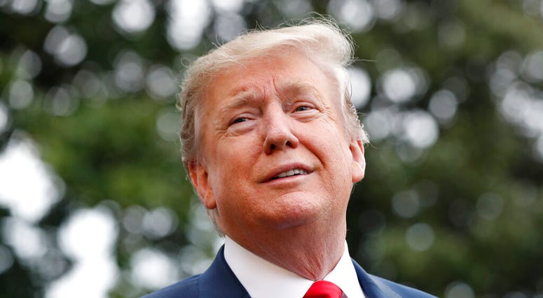 President Donald Trump speaks to the media as he departs the White House, Friday April 26, 2019, as he leaves Washington headed to Indianapolis where he is expected to speak at the annual meeting of the NRA. (AP Photo/Jacquelyn Martin)
