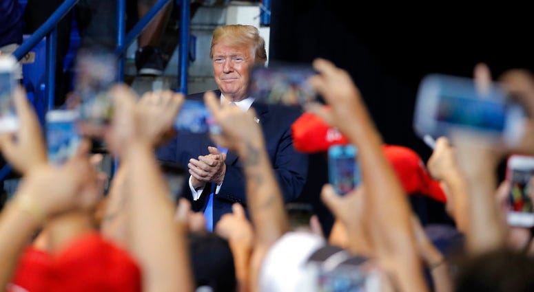 President Donald Trump arrives at a rally, Thursday, Aug. 2, 2018, at Mohegan Sun Arena at Casey Plaza in Wilkes Barre, Pa. (AP Photo/Carolyn Kaster)