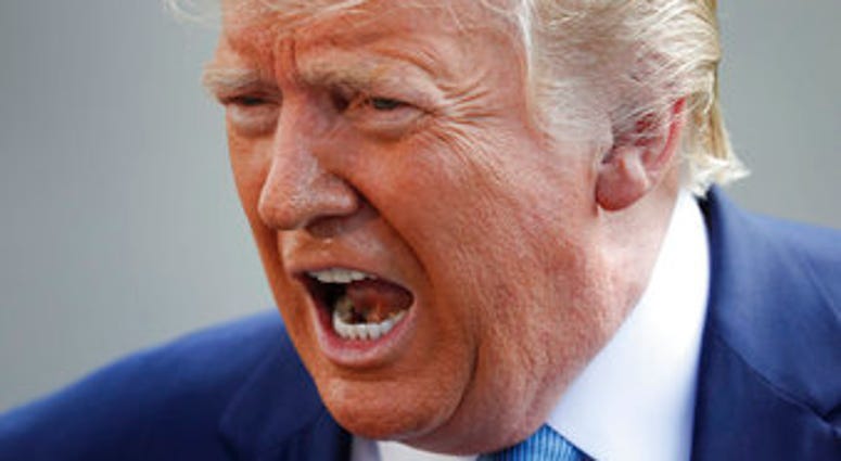 President Donald Trump speaking to the media on the South Lawn of the White House in Washington, Friday, Oct. 4, 2019, before his departure to nearby Walter Reed National Military Medical Center in Bethesda, Md. (AP Photo/Pablo Martinez Monsivais)