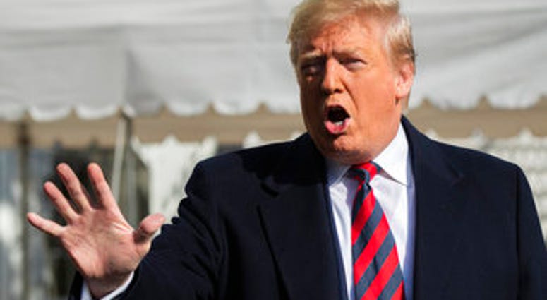 President Donald Trump talks to the media before leaving the White House, Saturday, Nov. 9, 2019, in Washington. (AP Photo/Manuel Balce Ceneta)