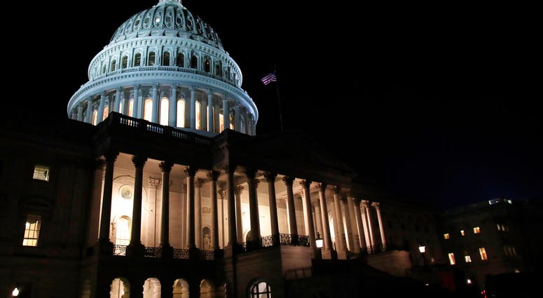 FILE- In this Feb. 5, 2019, file photo lights illuminate the U.S. Capitol dome in Washington. On Thursday, Feb. 14, the Labor Department reports on the number of people who applied for unemployment benefits last week. (AP Photo/Manuel Balce Ceneta, File)